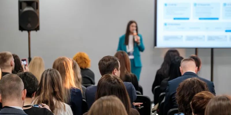 Group of people listening to a presentation