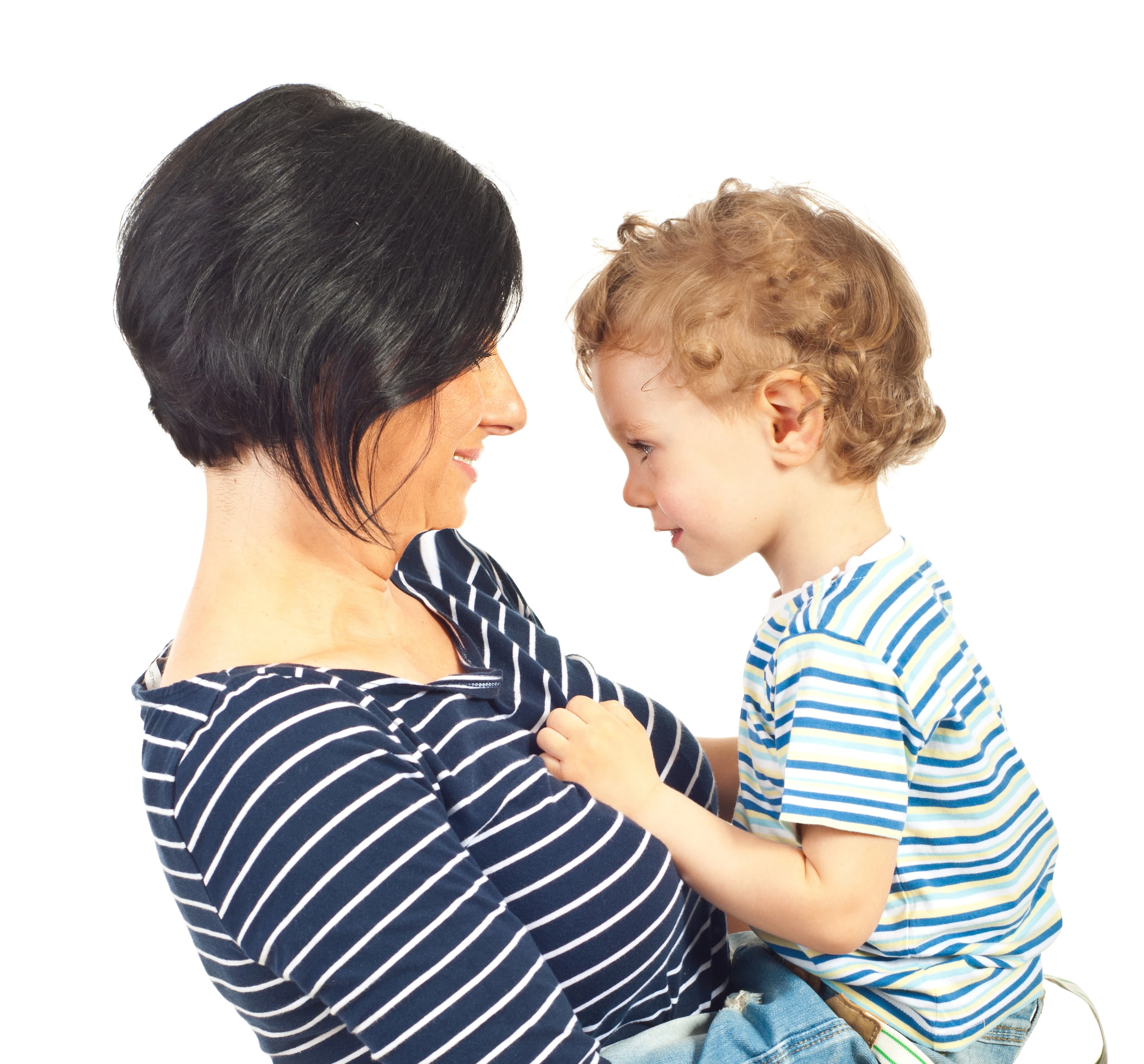 Happy mother holds her toddler in her arms and looks into his face